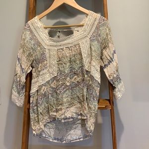 Flowy white, blue, light blue, and tan blouse.